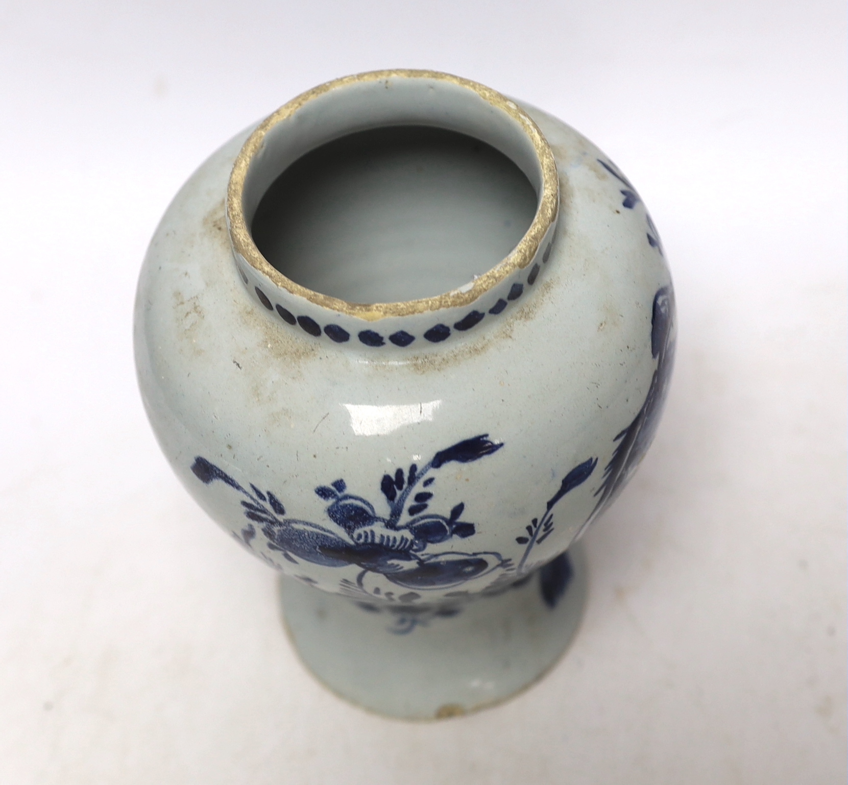 An 18th century Delft blue and white baluster vase, 17cm